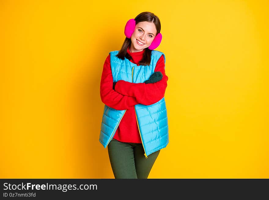 Photo of positive cheerful girl cross hands enjoy spend winter holidays, weekend wear season clothes isolated over bright color background