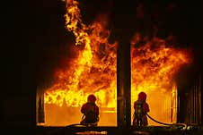 Firefighter Training, Fireman Using Water And Extinguisher To Fighting With Fire Flame In An Emergency Situation., Under Danger Stock Images