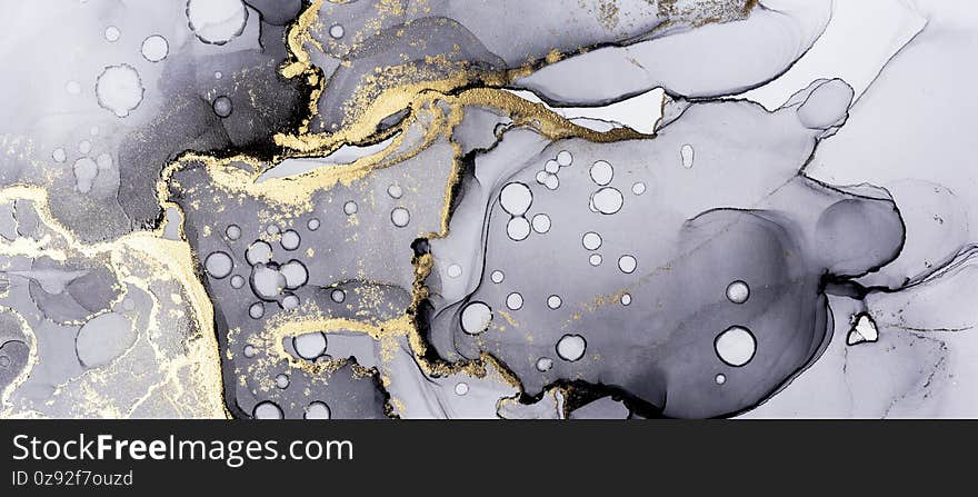 Closeup of black and shiny golden alcohol ink abstract texture, trendy wallpaper. Art for design project as background for invitation or greeting cards, flyer, poster, presentation, banner. Closeup of black and shiny golden alcohol ink abstract texture, trendy wallpaper. Art for design project as background for invitation or greeting cards, flyer, poster, presentation, banner
