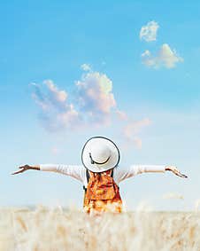 Woman Standing On A Golden Wheat Field Background Stock Images