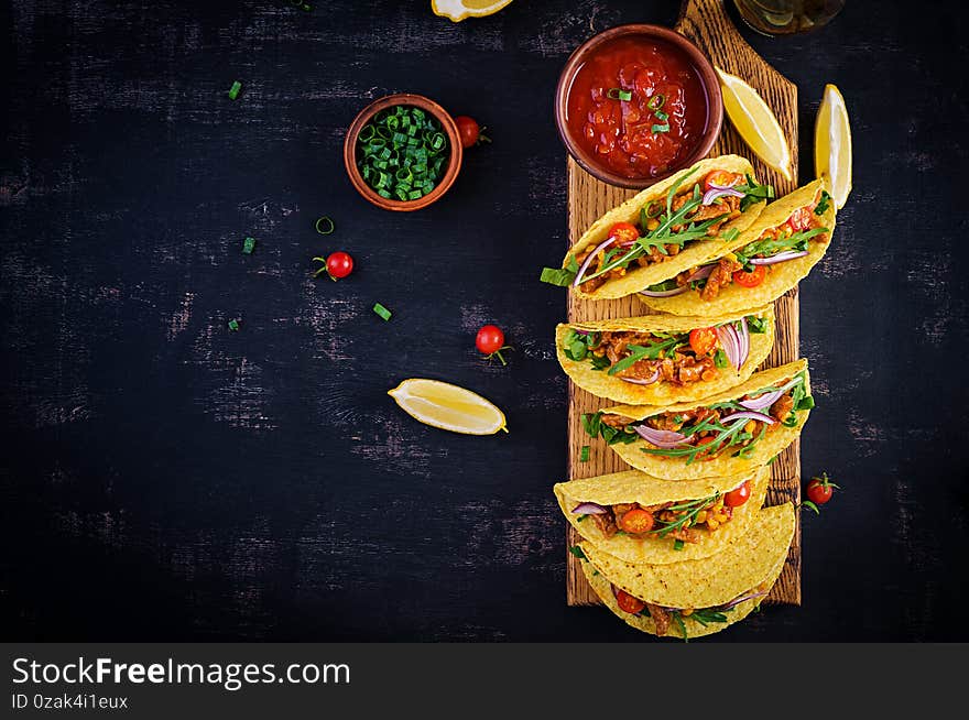 Taco. Mexican tacos with beef meat, corn and salsa. Mexican cuisine. Top view, flat lay, copy space