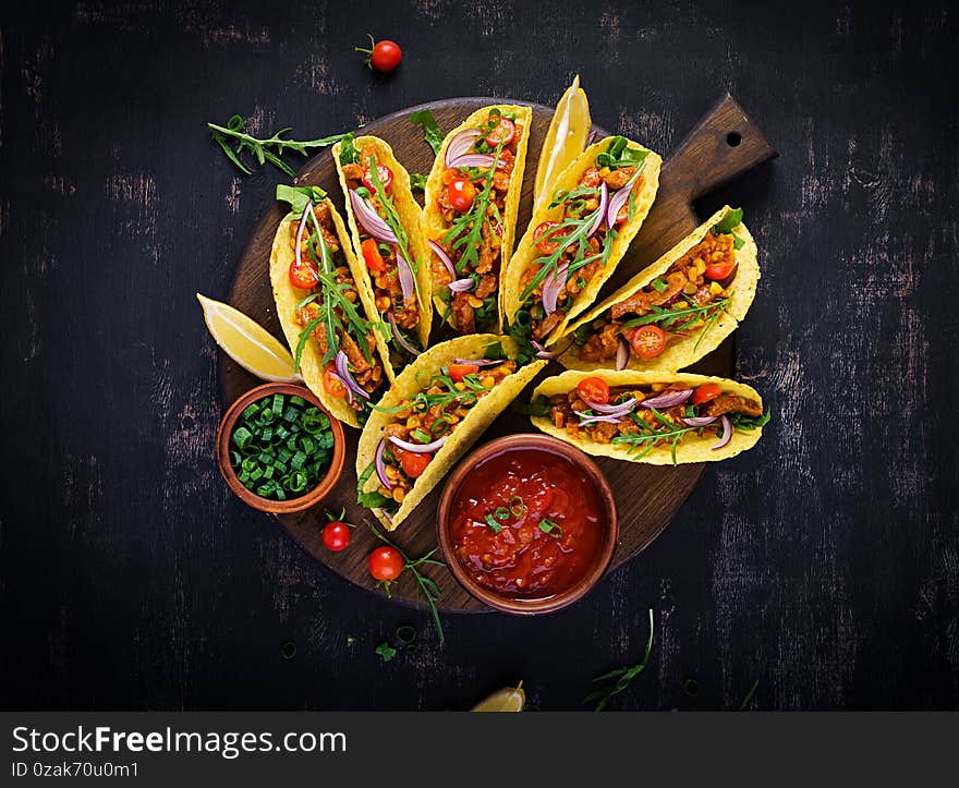 Taco. Mexican tacos with beef meat, corn and salsa. Mexican cuisine. Top view, flat lay, copy space