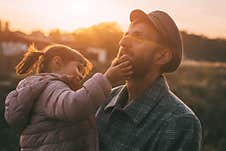 Portrait Of Dad And Daughter At Sunset On A Warm Autumn Day, Beautiful Light And Sunset Stock Photos