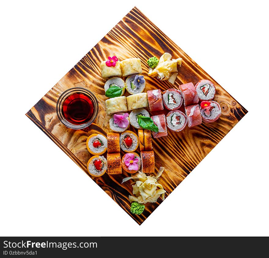 Set of sushi roll with salmon, avocado, cream cheese, cucumber, rice, caviar, eel, tuna in wooden plate isolated on white background