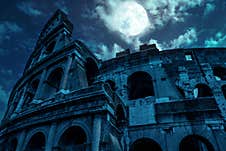 Colosseum At Night, Rome, Italy. Mystery Creepy View Of Ancient Coliseum In Full Moon Stock Photo