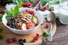 Breakfast Cereal, Table Setting. Healthy Tasty Breakfast Multigrain Wholewheat Healthy Cereals With Strawberries Stock Photography