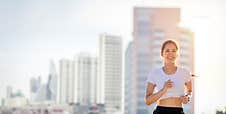 Smiling Asian Young Fitness Sport Woman Running  And Sportive People Training In A Urban Area, Healthy Lifestyle And Sport Stock Images