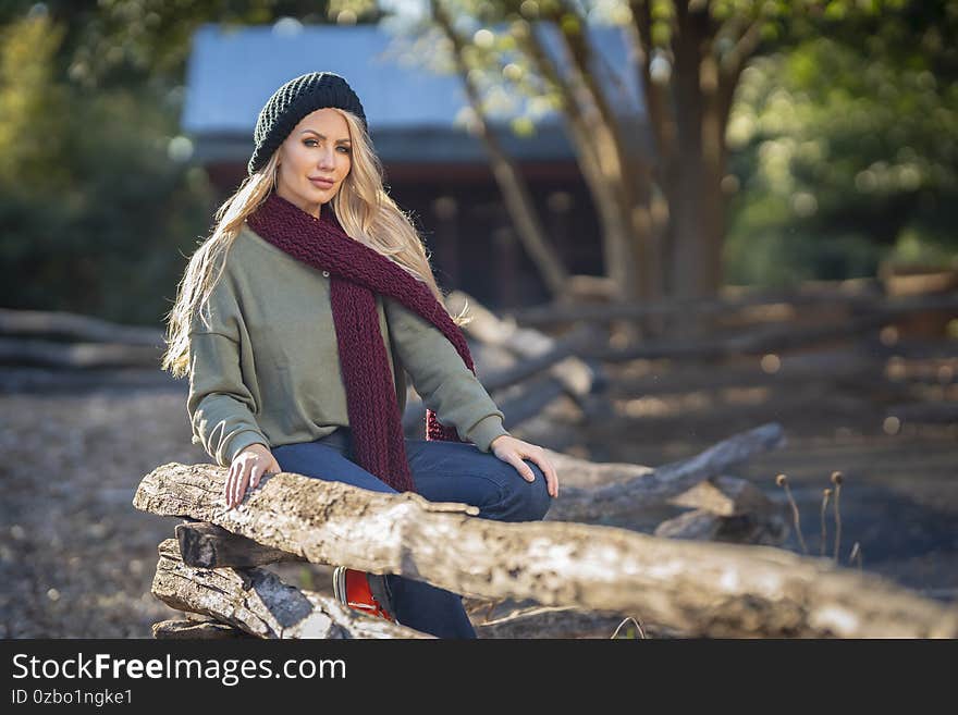 A Lovely Blonde Model Poses In Her Beautiful Fall Clothing