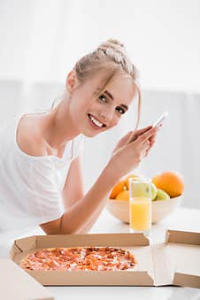 Blonde Woman Looking At Camera While Stock Image