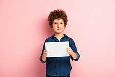 Boy In Denim Shirt Holding Digital Royalty Free Stock Images