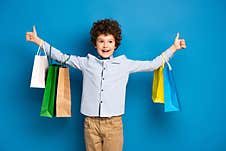 Curly Boy Standing With Outstretched Hands Royalty Free Stock Image