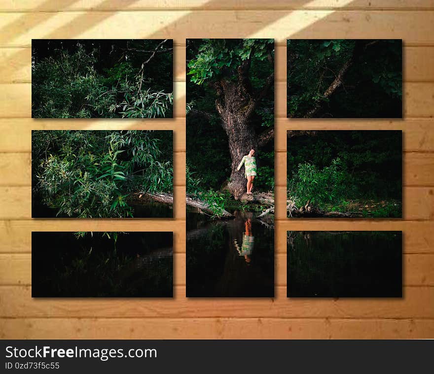 A girl by the water under an old oak tree