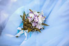 Wedding Bouquet Of Eustomas And Chrysanthemums On A Blue Tulle Background Royalty Free Stock Images