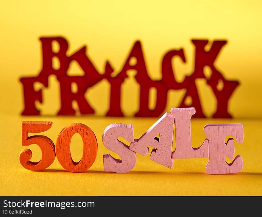 Black Friday, sales and discounts.On a yellow background, the words black Friday and discounts