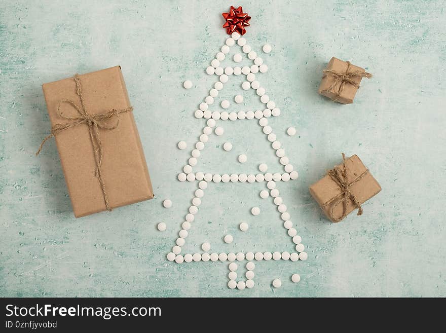 Christmas present, gifts. Christmas card. Christmas tree made from pills. New Year`s composition from medical pills. Christmas present, gifts. Christmas card. Christmas tree made from pills. New Year`s composition from medical pills.