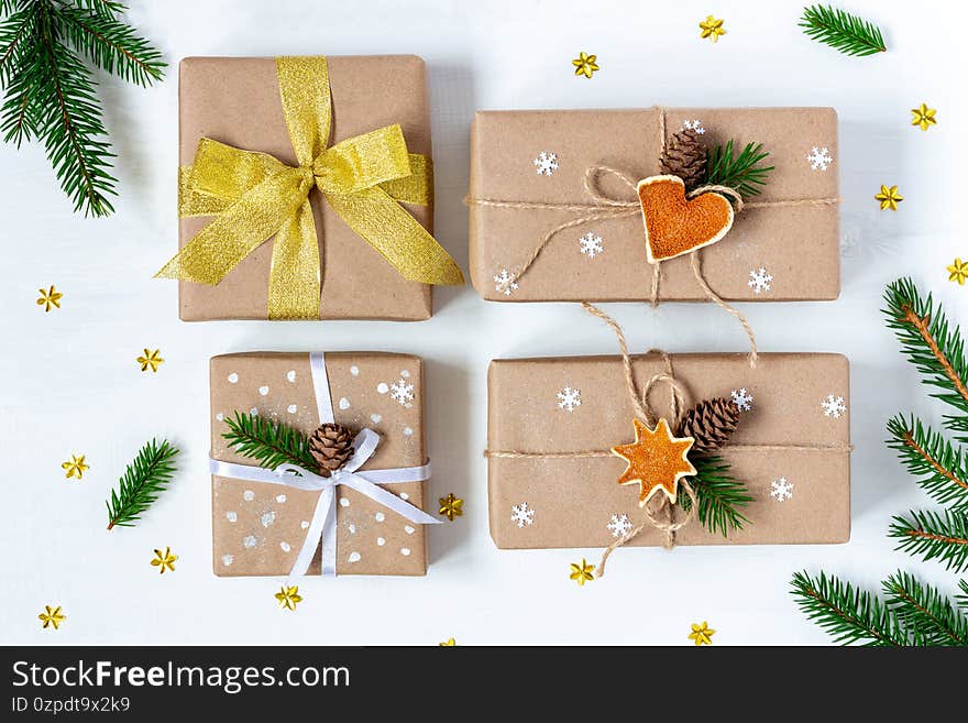 Four Christmas and New Year presents wrapped in eco paper