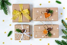 Four Christmas And New Year Presents Wrapped In Eco Paper Stock Image