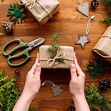 Female Hands Tying Holiday Craft Gift Box Stock Photography