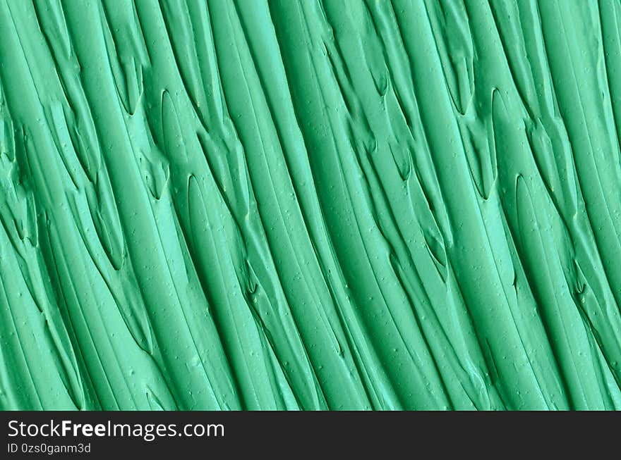 Green cosmetic clay kelp facial mask, face cream, spirulina body wrap texture close up, selective focus. Abstract background