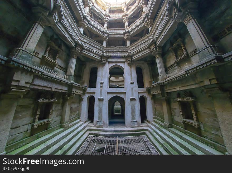 This is the interior of the step well in Adalaj near Ahmedabad, Gujarat , India. This is the view from the lowest floor of the stepwell. It was shot in summer season when the water dried up. This is the interior of the step well in Adalaj near Ahmedabad, Gujarat , India. This is the view from the lowest floor of the stepwell. It was shot in summer season when the water dried up.