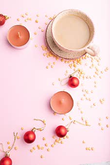 Christmas Or New Year Composition. Decorations, Red Balls, Cup Of Coffee, On A Pink Background. Top View, Copy Space Royalty Free Stock Photos