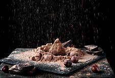 Chocolate Truffle Sprinkled With Cacao And Golden Powder Stock Photo