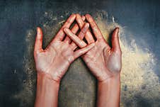 Open Palms Up Of The Girl`s Hands In Sequins On A Dark Background Royalty Free Stock Photos