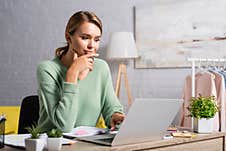 Freelancer Using Laptop While Working Near Royalty Free Stock Photos