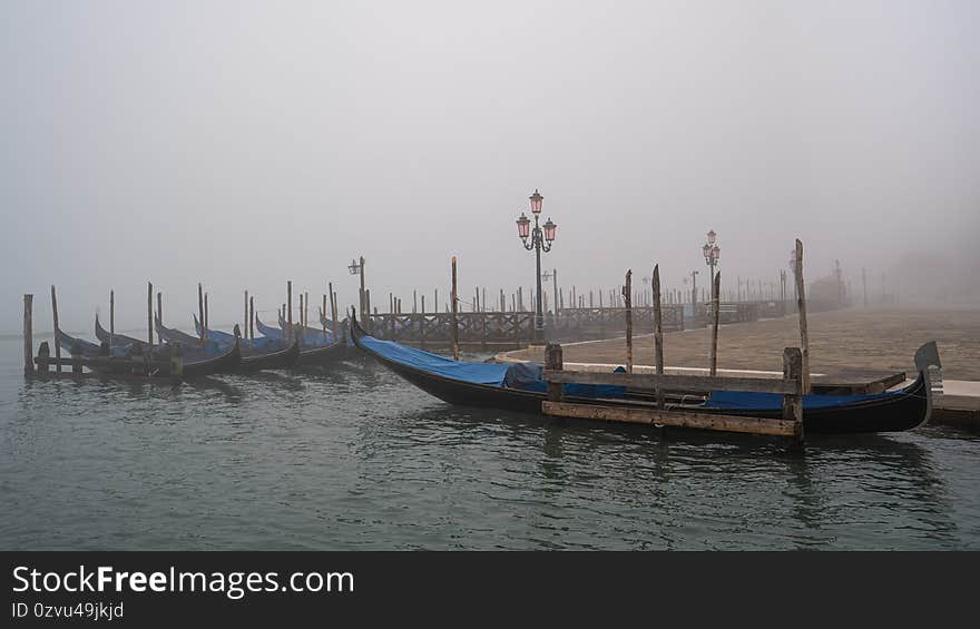 Gondolas in Venice in the mist