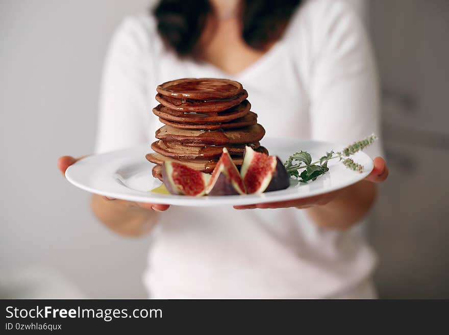 Lady is preparing dessert. Confectioner bakes a pancakes.Woman cooked food. Lady is preparing dessert. Confectioner bakes a pancakes.Woman cooked food.