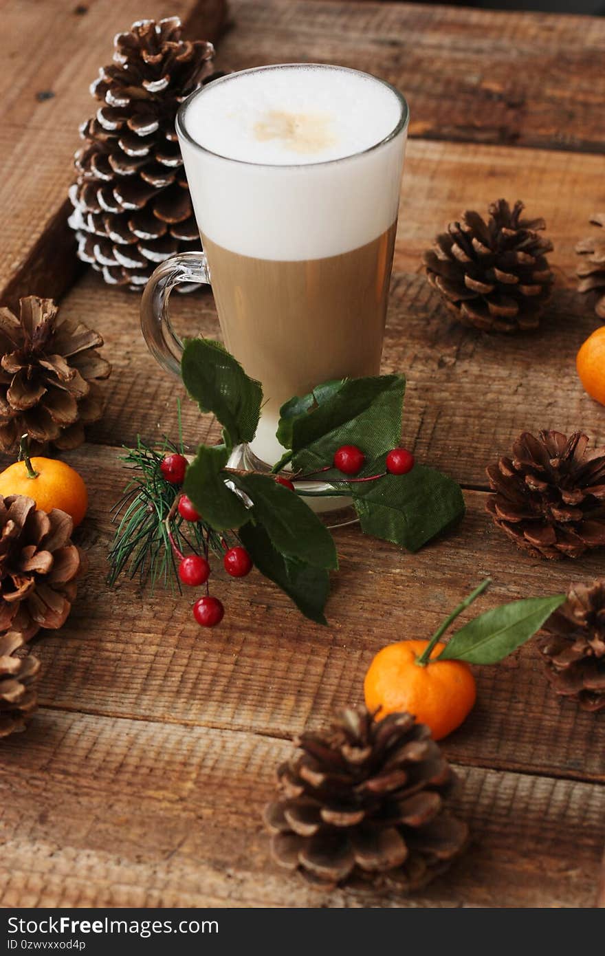 Coffee latte and forest cones on the table macro