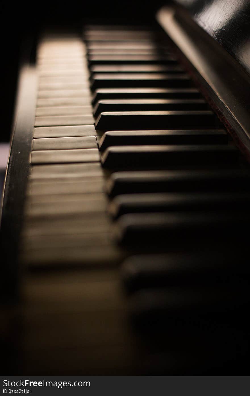 Old piano keyboard, with shallow depth of field