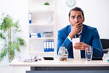 Young Male Accountant In Budget Planning Concept Stock Photo