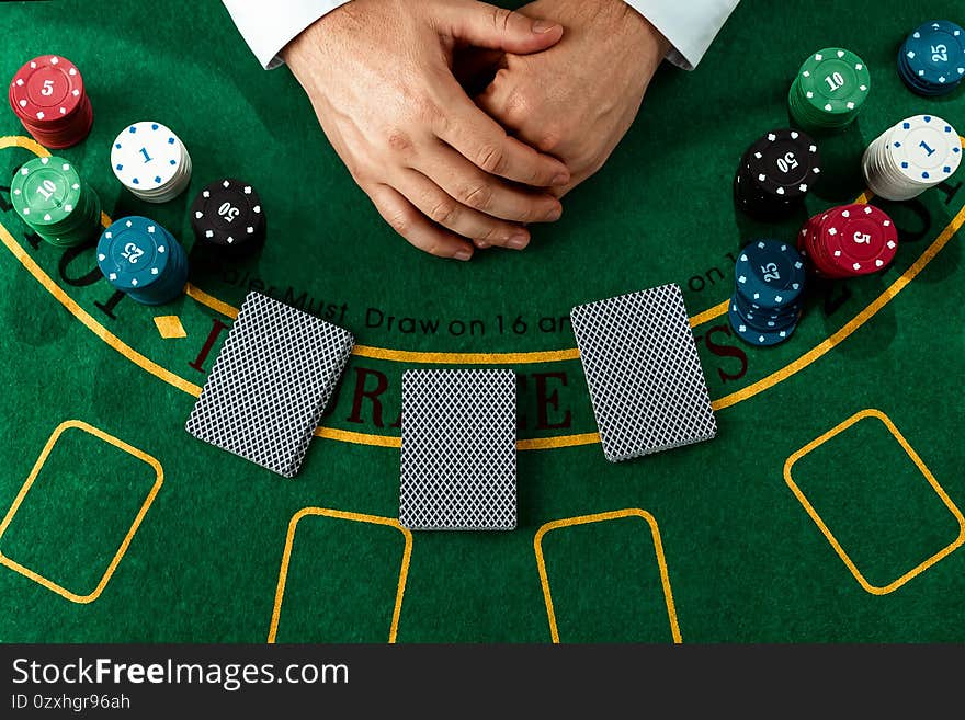 Male hands croupier shuffles cards close-up. Casino concept, gambling, blackjack