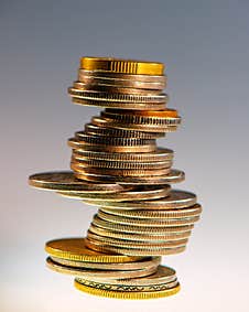 Stack Of Different Coins On A Light Background Stock Photos