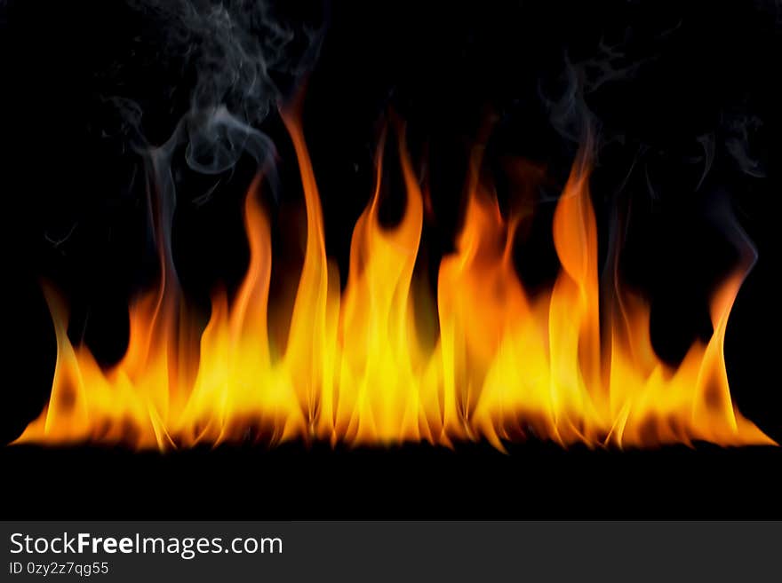 The surface of the fire and the burning smoke are hot on a black background.