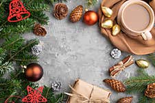 Christmas Or New Year Frame Composition. Decorations, Cones, Fir And Spruce Branches, Cup Of Coffee, On A Gray Concrete Background Royalty Free Stock Photo