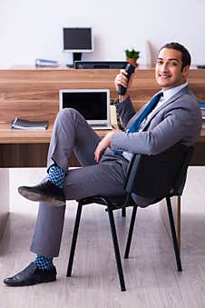 Young Male Employee Working In The Office Stock Images