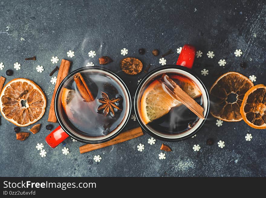 Mulled wine background. A hot winter Christmas drink based on red wine, spices and citrus fruits