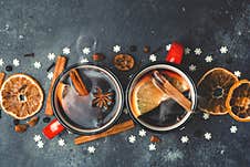 Mulled Wine Background. A Hot Winter Christmas Drink Based On Red Wine, Spices And Citrus Fruits Royalty Free Stock Image