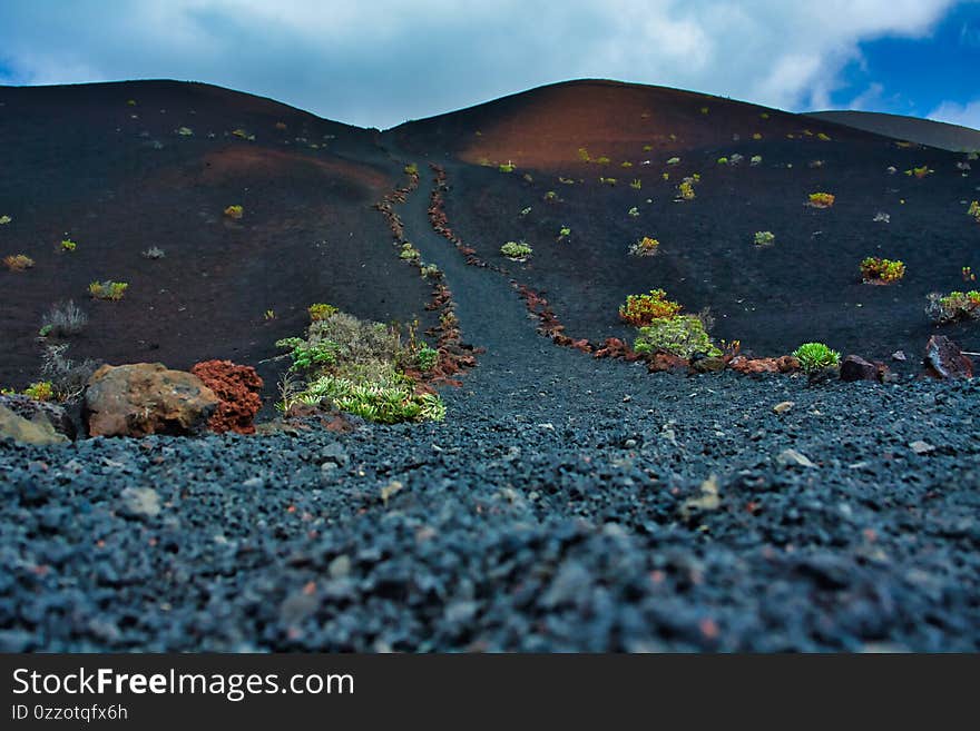 Hiking trail with lava rocks on the island of La Palma. Hiking trail with lava rocks on the island of La Palma.