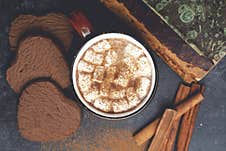 Hot Chocolate Cocoa Drink Backround. Cocoa Drink On A Dark Background With Cinnamon And Whipping. Winter Hot Drinks Royalty Free Stock Photography