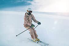 Woman Skiing On Mountain Top Royalty Free Stock Photo