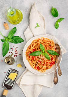 Spaghetti With Tomato Sauce, Fresh Basil, Parmesan Cheese, Olive Oil And Spices. Mediterranean Italian Cuisine. Delicious Pasta Royalty Free Stock Photography