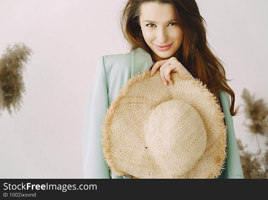 Fashion girl posing in a photo studio