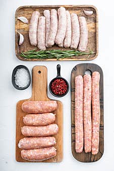 Assorted Raw Homemade Sausages, Flat Lay, On White Background Stock Photography