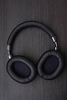 Wireless Full-size Headphones On A Dark Background, Close-up Royalty Free Stock Image