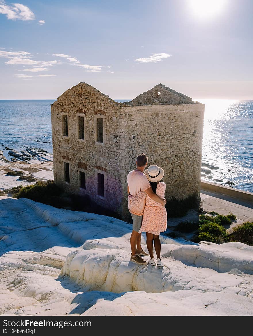 Punta Bianca, Agrigento in Sicily Italy White beach with old ruins of an abandoned stone house on white cliffs. Sicilia Italy, couple on vacation in Italy. Punta Bianca, Agrigento in Sicily Italy White beach with old ruins of an abandoned stone house on white cliffs. Sicilia Italy, couple on vacation in Italy