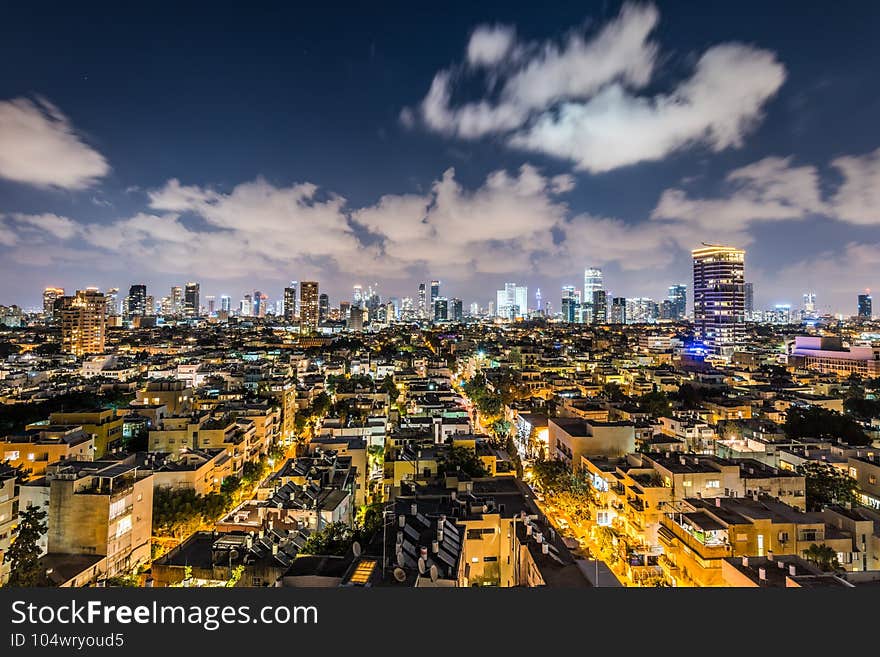 Night aerial view of Tel Aviv City with modern skylines and luxury hotels at the beach near the Tel Aviv port in Israel