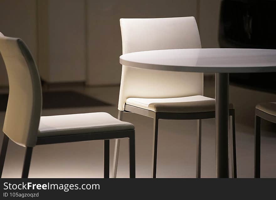A table and chair of the furniture of the room